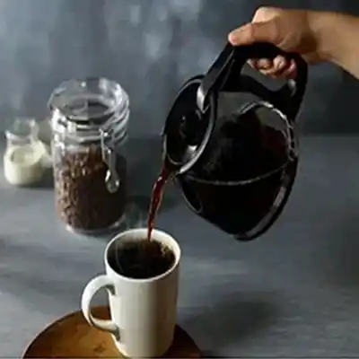 coffee cup with jar and beans on table